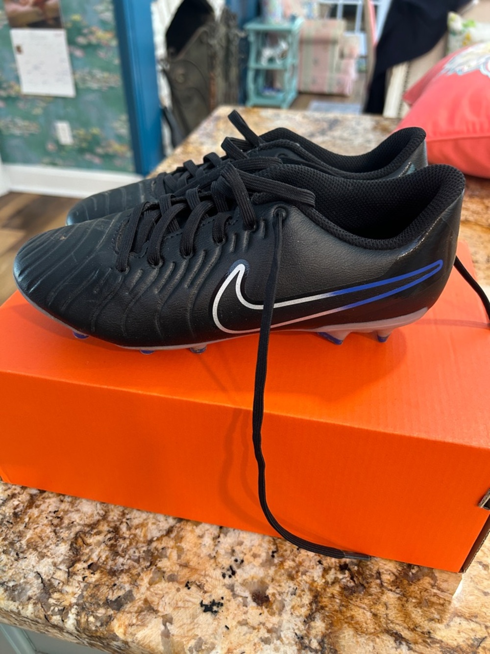Nike Boys’ 4.5 Black Soccer Cleats with Blue and White Accents